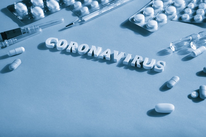 Text Coronavirus, pills, syringes, thermometer. Monochrome image