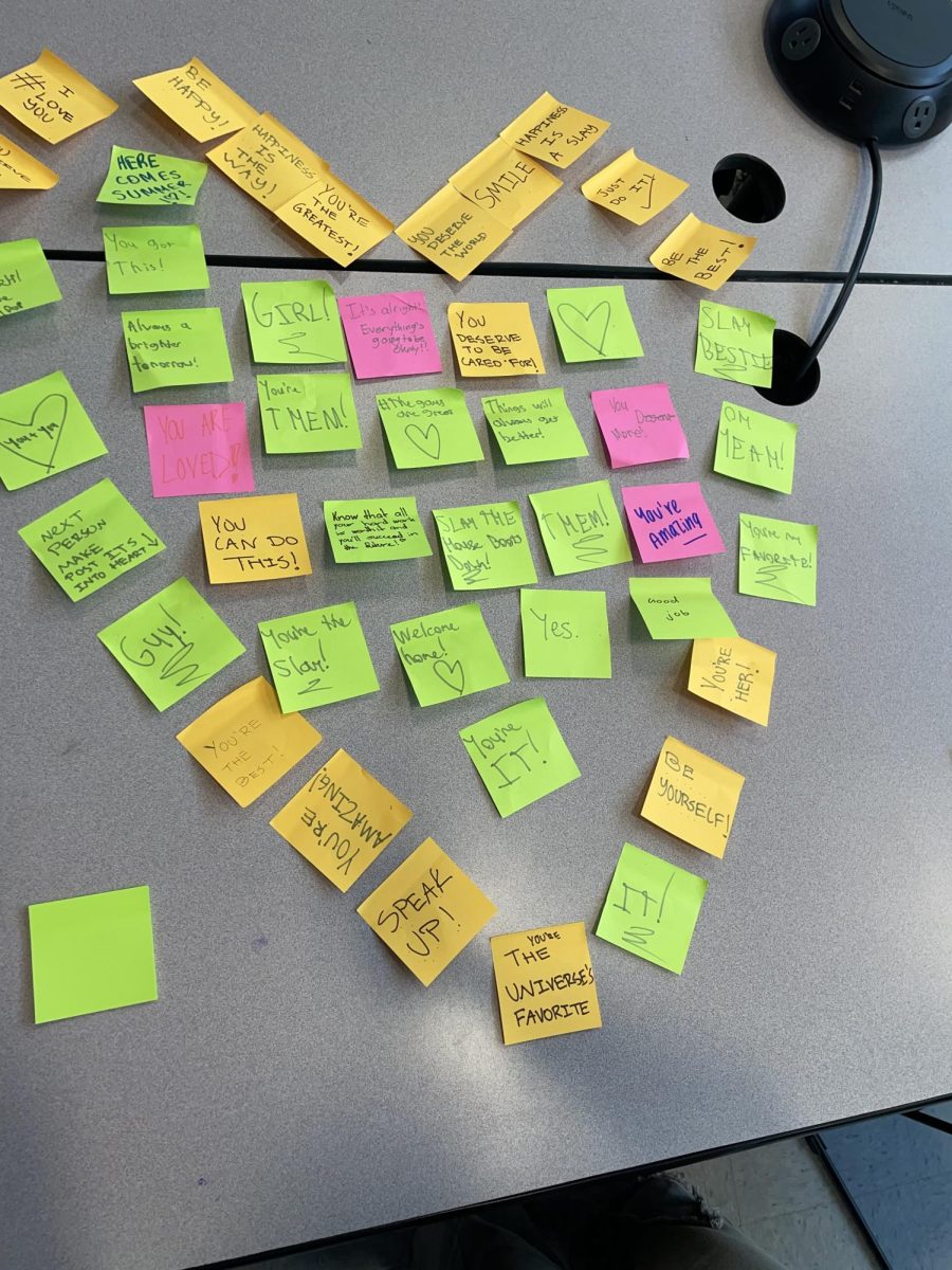 Sayreville HOSA taking part in promoting the medical club/community with post-it activity